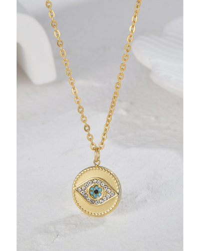 This sleek stainless steel necklace is adorned with an ornate evil eye charm - a perfect blend of fashion and protection.